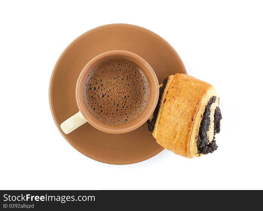 Coffee cup and a poppy roll isolated on white background. Coffee cup and a poppy roll isolated on white background