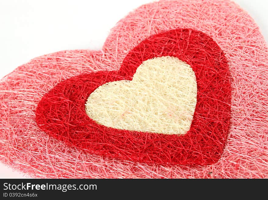 Red heart of the thread isolated on white background. Red heart of the thread isolated on white background