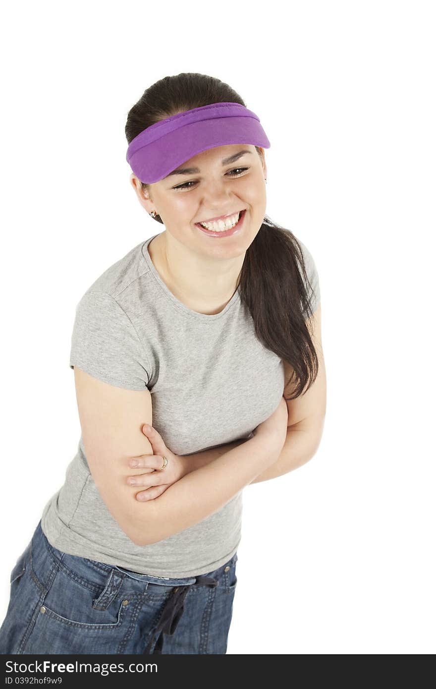 Grinning teenage girl standing with folded arms