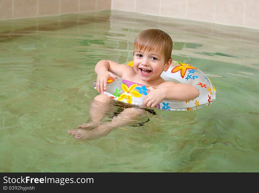 Little happy boy swimming in pool. Little happy boy swimming in pool