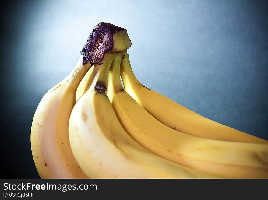 Macro abstract of banana with light blue gel filter on the background. Macro abstract of banana with light blue gel filter on the background