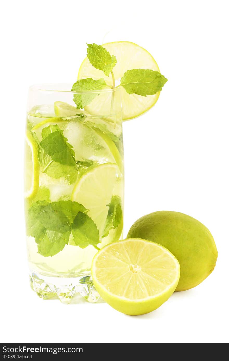 Mojito cocktail with lime, mint leaves and ice on white background. Mojito cocktail with lime, mint leaves and ice on white background