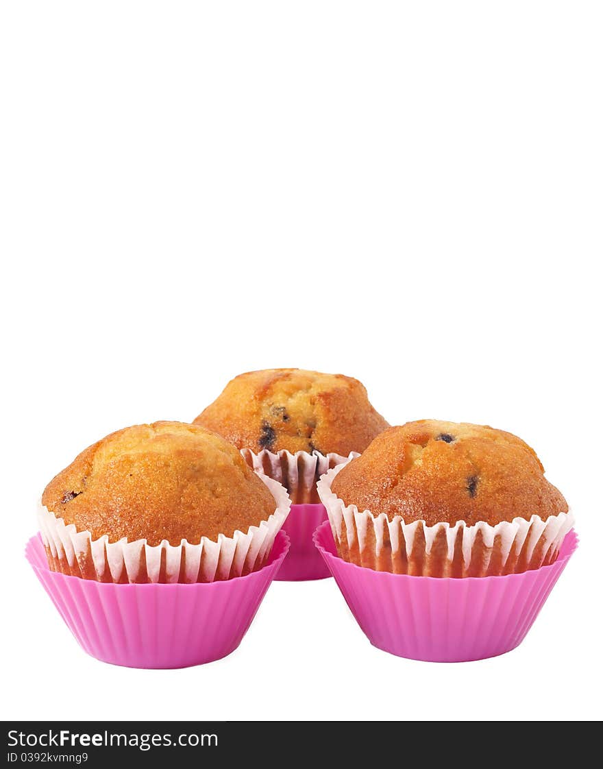 Fresh blueberry muffins in pink cups isolated on white background. Fresh blueberry muffins in pink cups isolated on white background