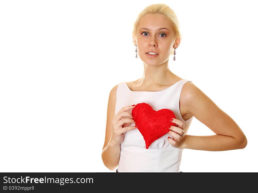 Young attractive elegant woman holding a big red heart. Isolated on a white background. Young attractive elegant woman holding a big red heart. Isolated on a white background