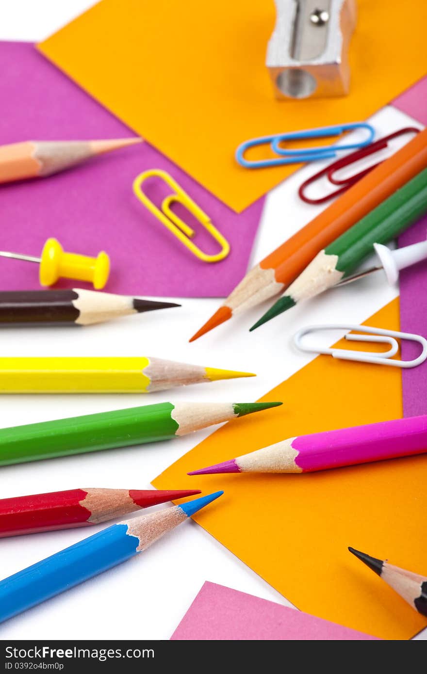 Office and student tool with colorful pencils over white background