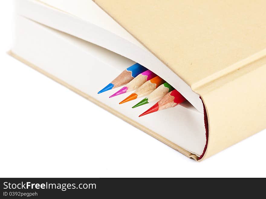 Colorful Pencils On Closed Book