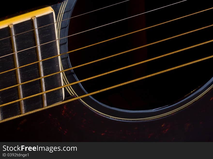 Close-up of strings of a folk guitar