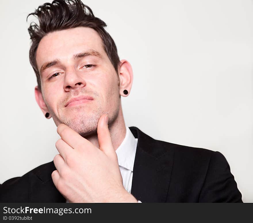 Confident young man front on shoot. Confident young man front on shoot