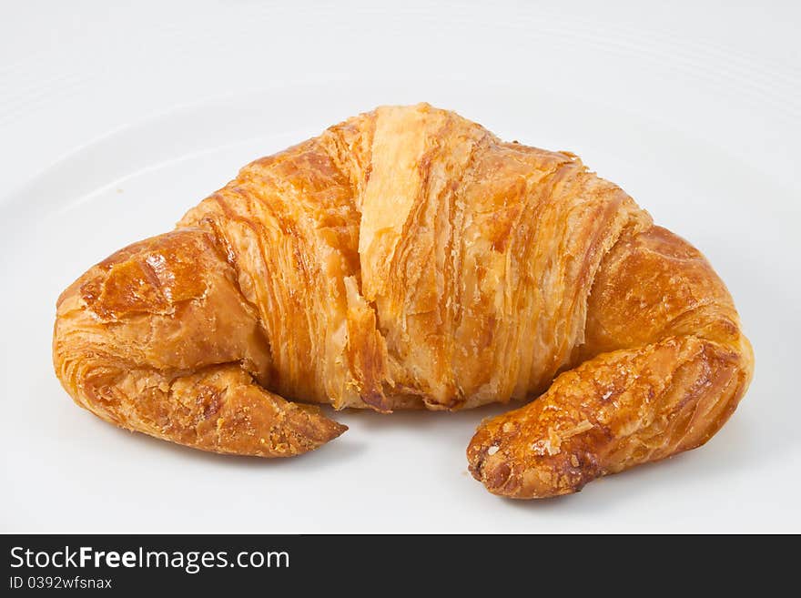 A croissant on white background