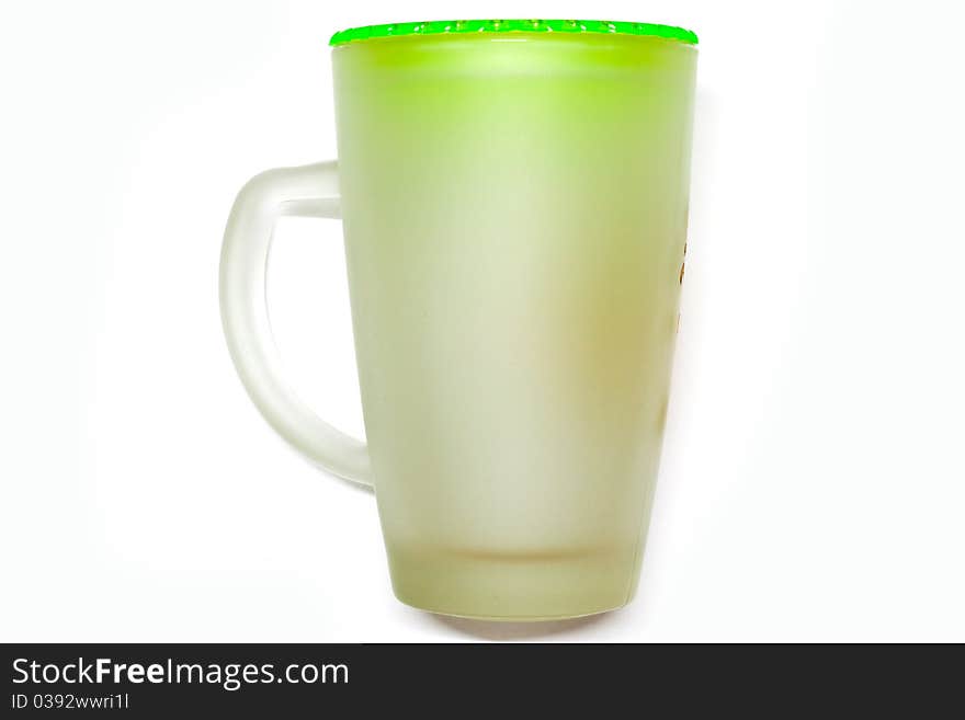 Glass of water on a white background with a green cap