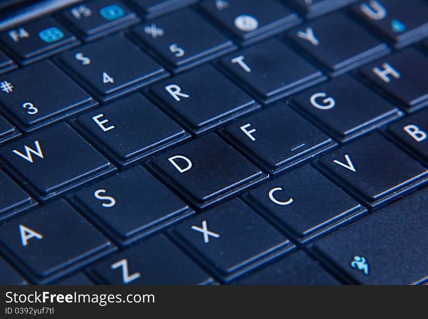 The keyboard on from the laptop with the letters put on it close up. The keyboard on from the laptop with the letters put on it close up