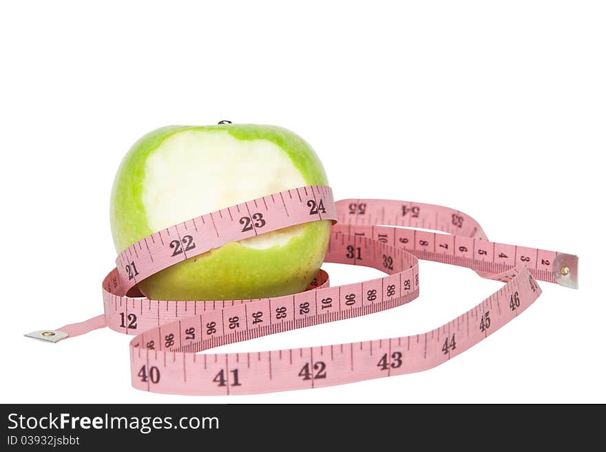 Green apple and tape isolated on white background