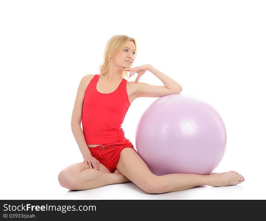 Pretty sporty fitness woman doing exercise with pilates ball. isolated over white. Pretty sporty fitness woman doing exercise with pilates ball. isolated over white
