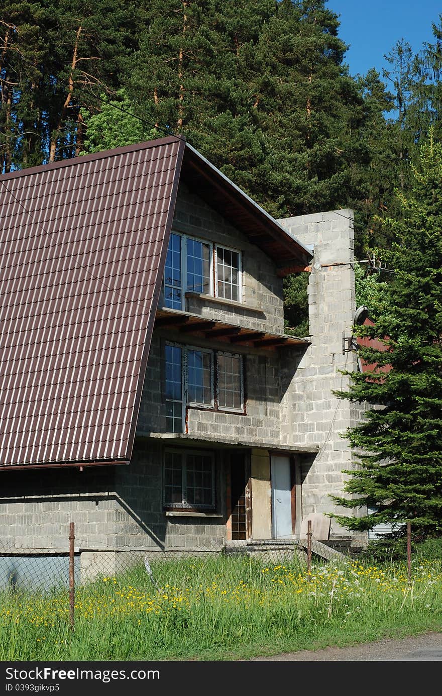 A not finished house that is building in mountains. A not finished house that is building in mountains