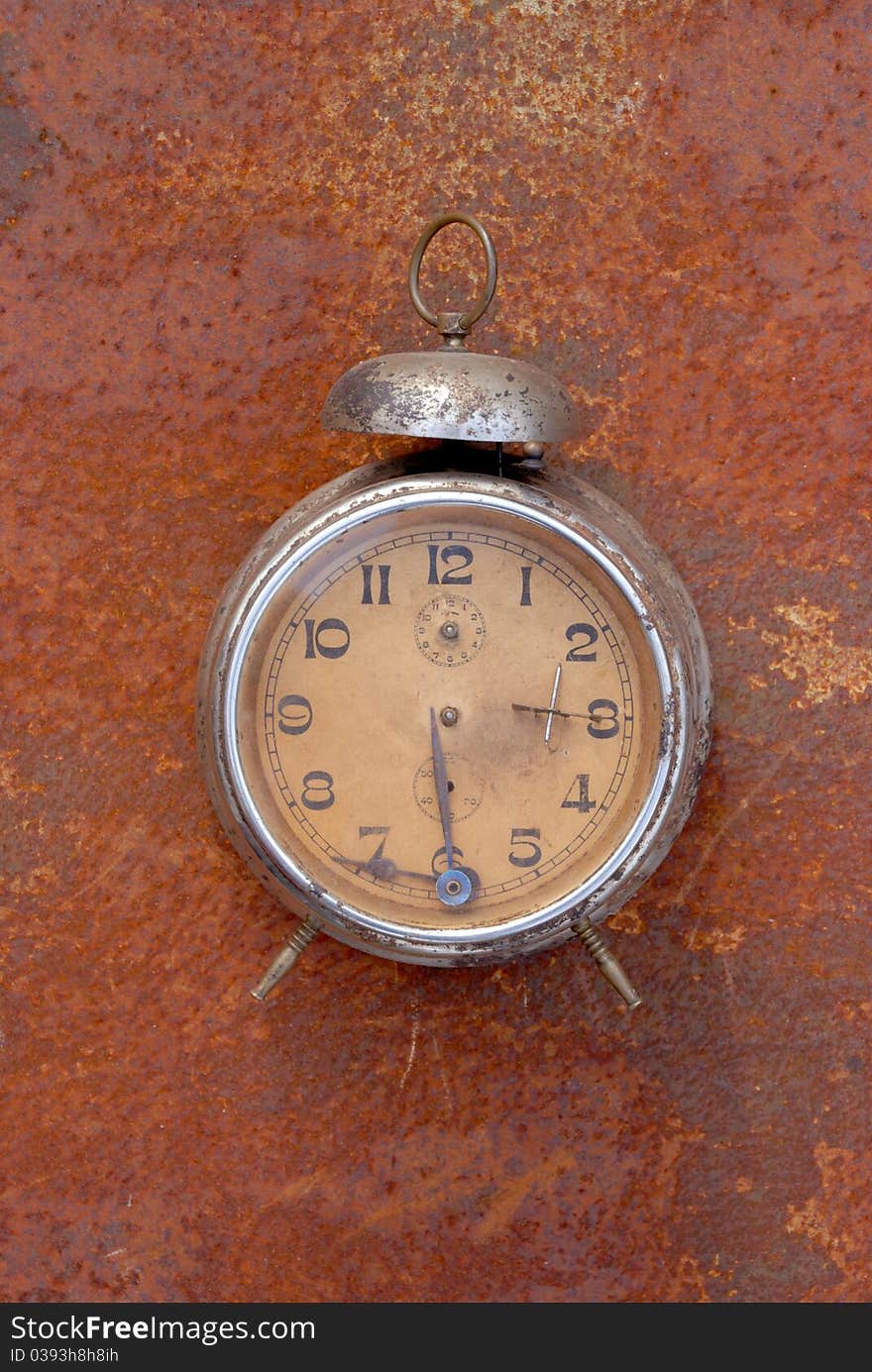 Vintage clock on rusting bacground. Vintage clock on rusting bacground