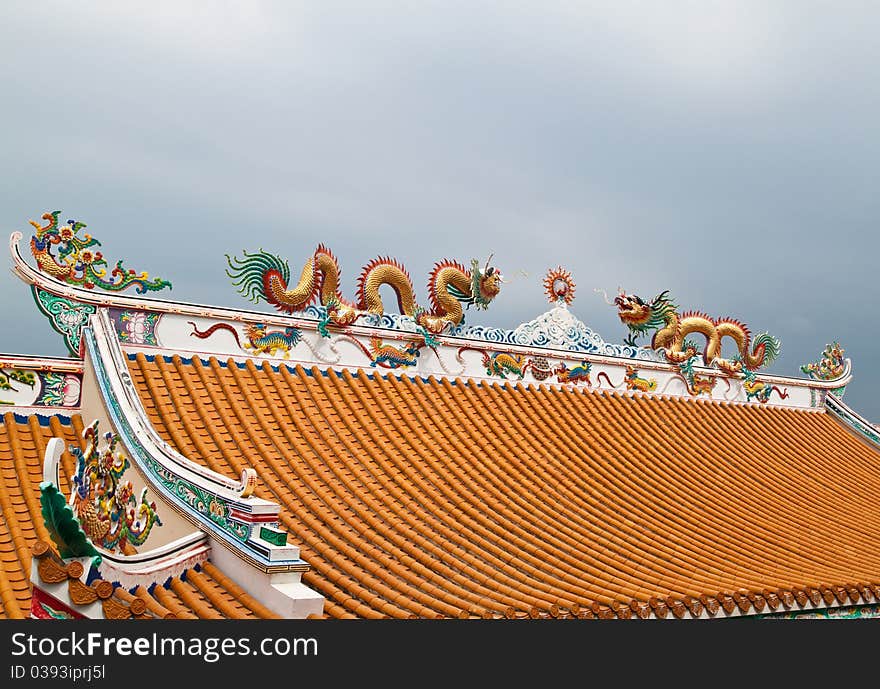 Dragon sculpture on roof of chinese shrine,East of Thailand