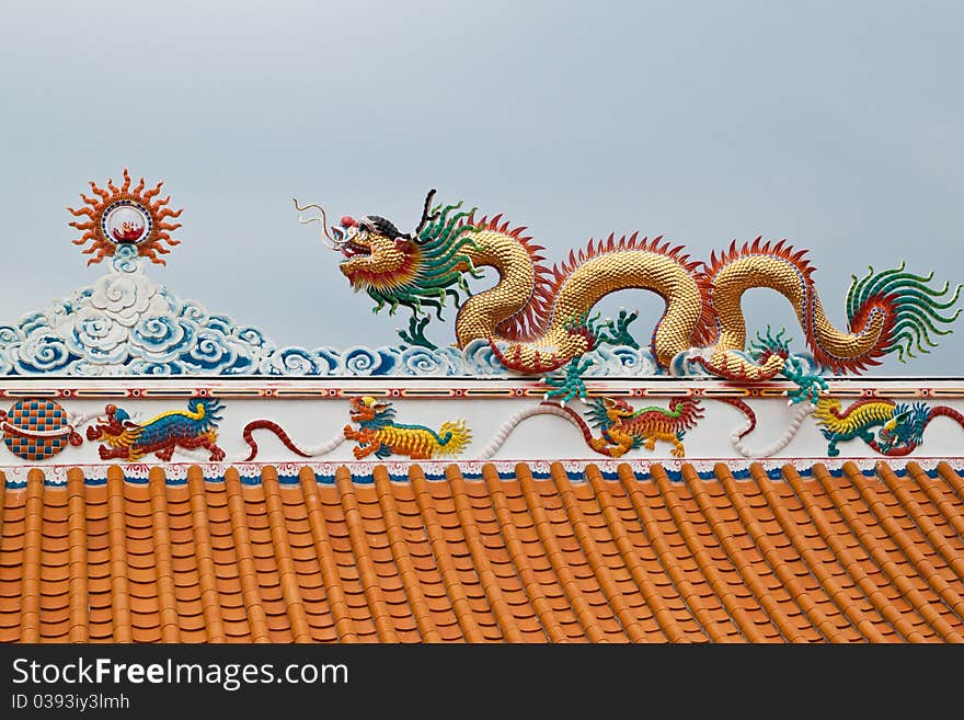 Dragon sculpture on roof of chinese shrine,East of Thailand