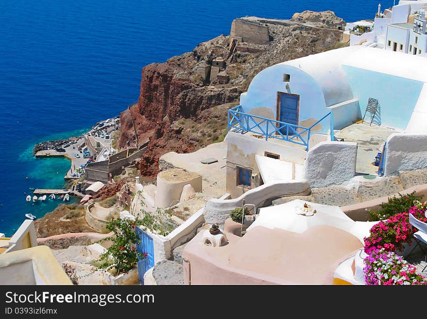 Beautiful street and traditional white and blue architecture on island of Santorini in Fira, Greece. Beautiful street and traditional white and blue architecture on island of Santorini in Fira, Greece.