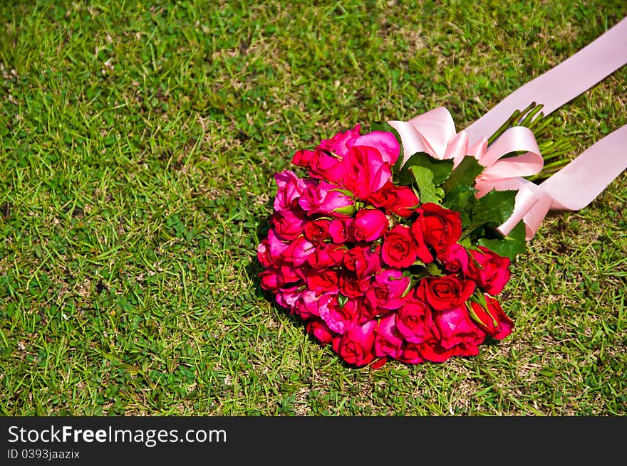 Bouquet of rose on the lawn