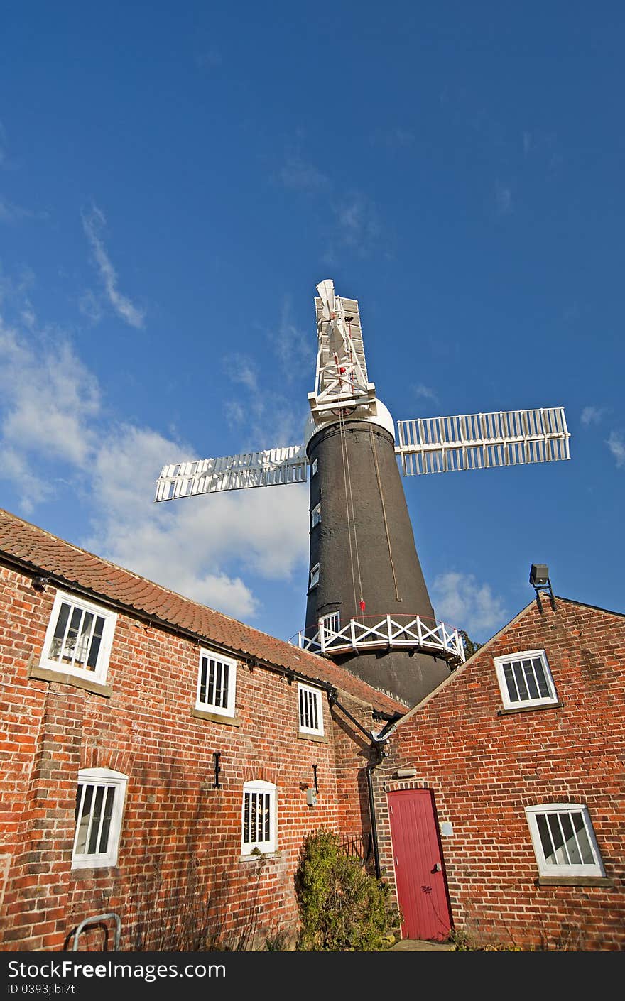 Traditional working windmill at a granary in the countryside