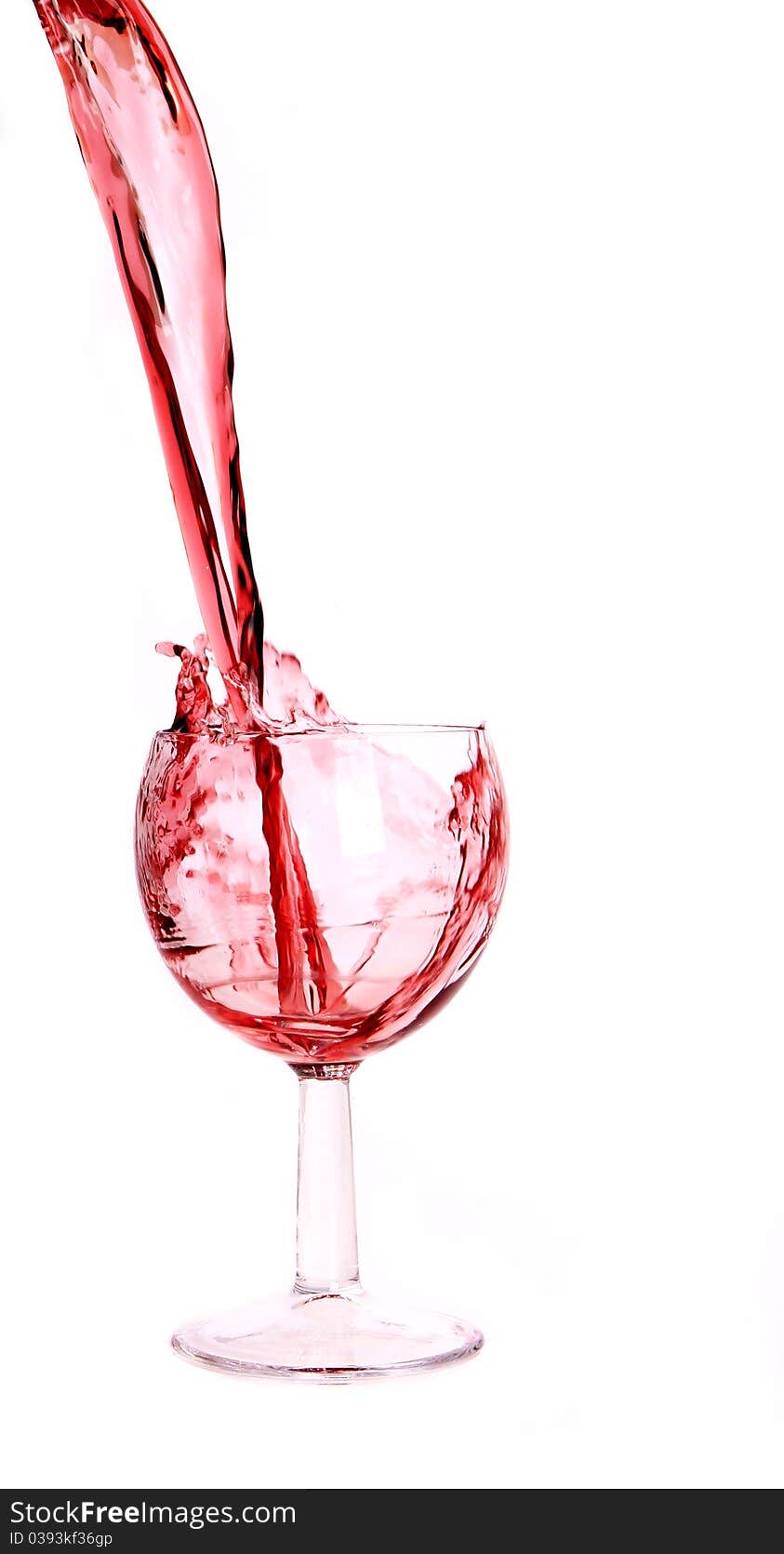 Studio photo of pouring red wine into glass.Isolated on white background. Studio photo of pouring red wine into glass.Isolated on white background