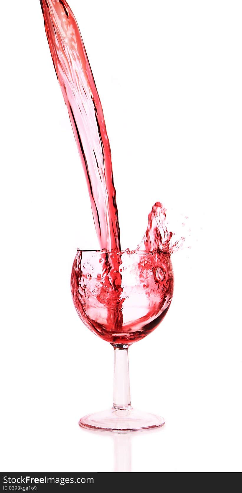 Studio photo of pouring red wine into glass.Isolated on white background. Studio photo of pouring red wine into glass.Isolated on white background