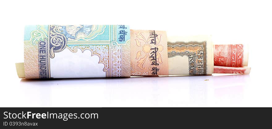 Rolled indian rupees notes over white background. Rolled indian rupees notes over white background.