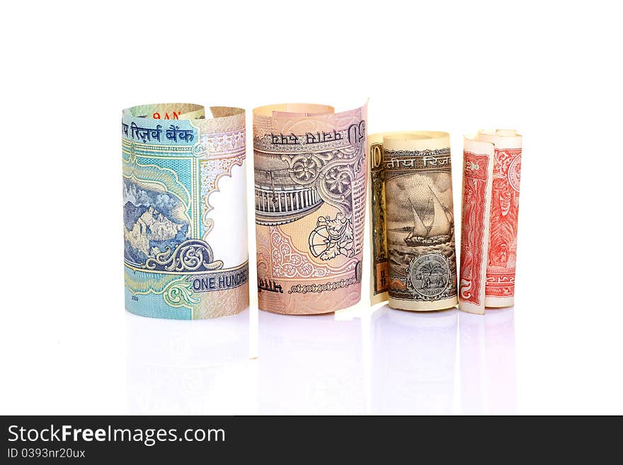 Rolled indian  rupees notes over white background. Rolled indian  rupees notes over white background.