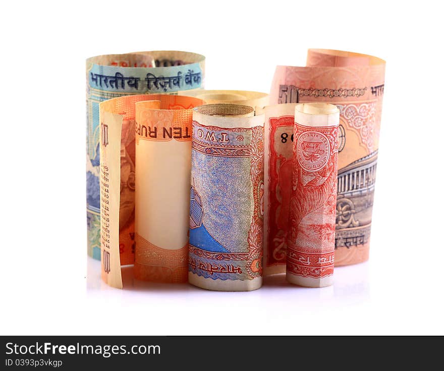 Rolled indian  rupees notes over white background. Rolled indian  rupees notes over white background.