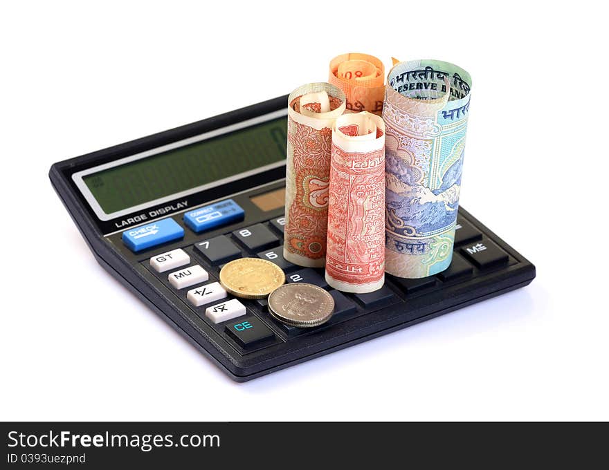 Currency notes and coins with calculator over white isolated background. Currency notes and coins with calculator over white isolated background.