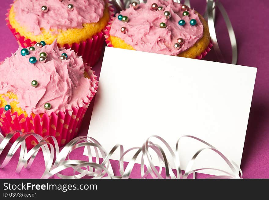 Cupcakes with a blank invitation