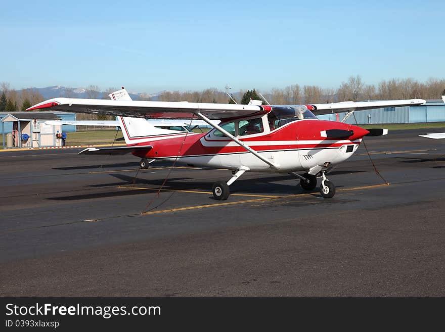 Small single engine aircraft parked at the Troutdale airport near Portland Oregon. Small single engine aircraft parked at the Troutdale airport near Portland Oregon.