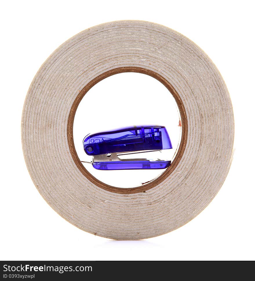 Tape and stapler isolated over white background.