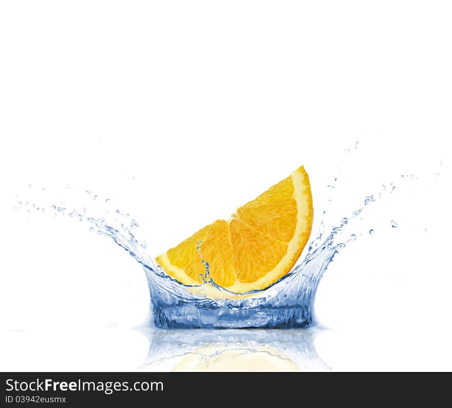 SLice of orange falling into water, isolated on white background. SLice of orange falling into water, isolated on white background