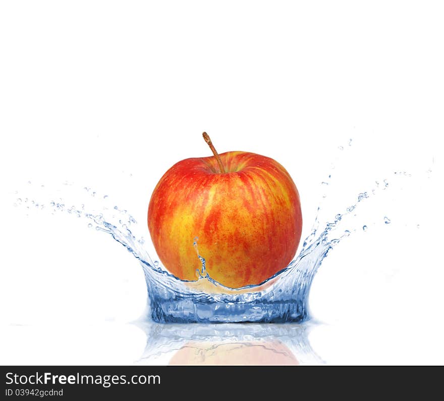 Red apple falling into water, isolated on white background. Red apple falling into water, isolated on white background