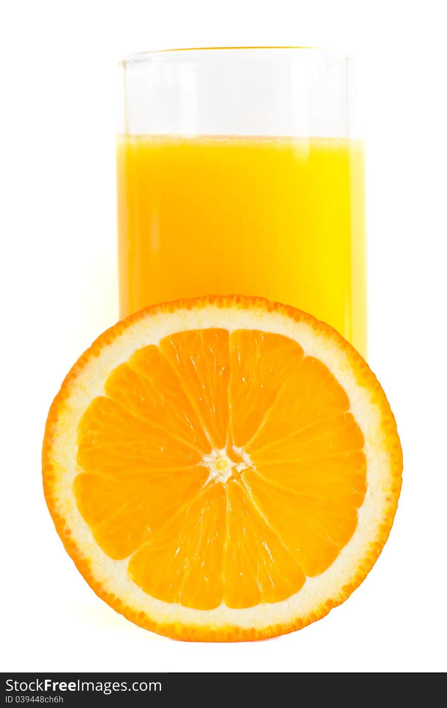 Half an orange and a glass of juice. White background. Half an orange and a glass of juice. White background.
