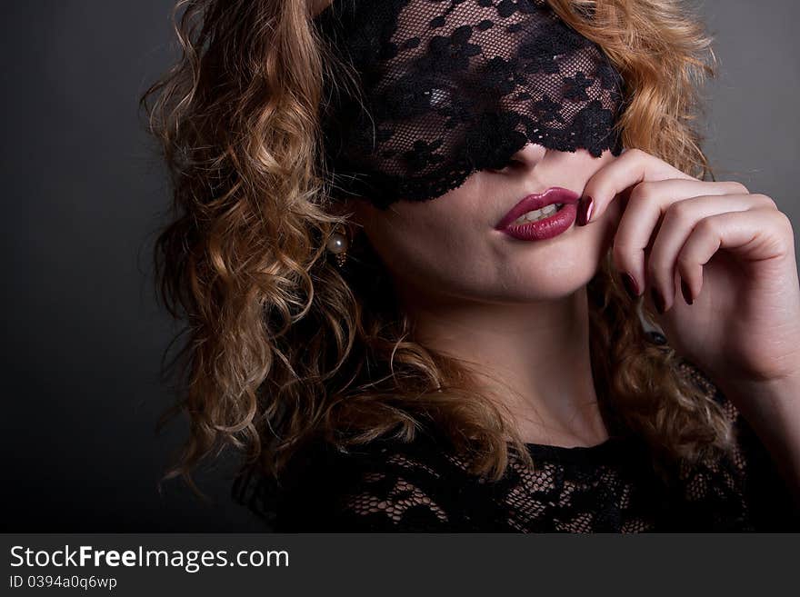 Beautiful woman with lace mask