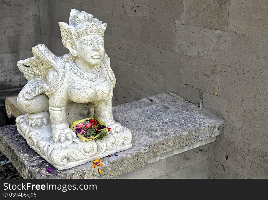 Flowering offering or sesajen in front of a home in Bali Island, indonesia. Flowering offering or sesajen in front of a home in Bali Island, indonesia