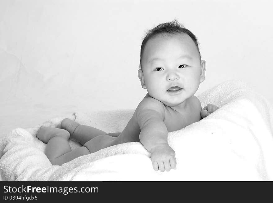 A cute baby with smiling in a black and white style