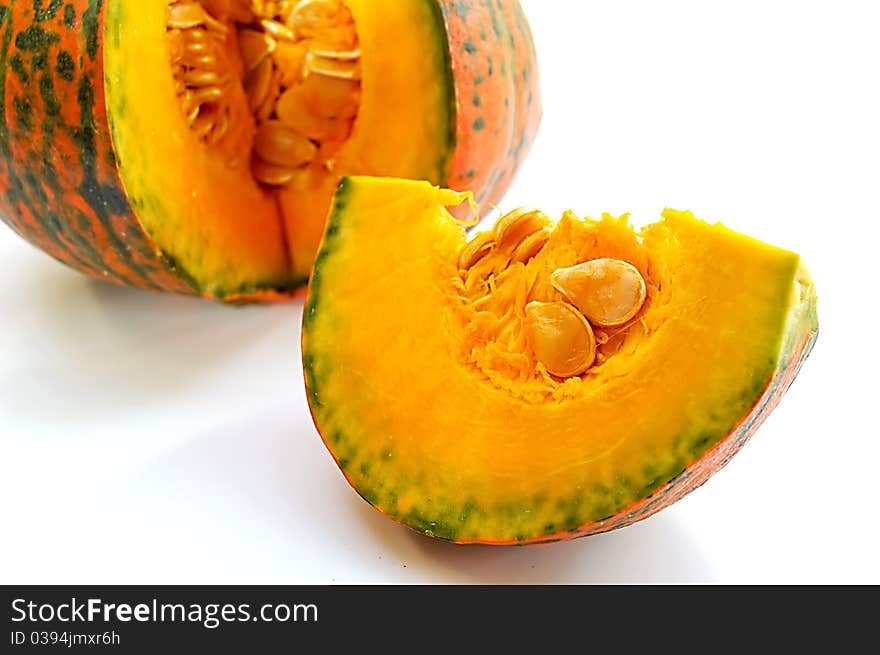 Freshly cut pumpkin on white background