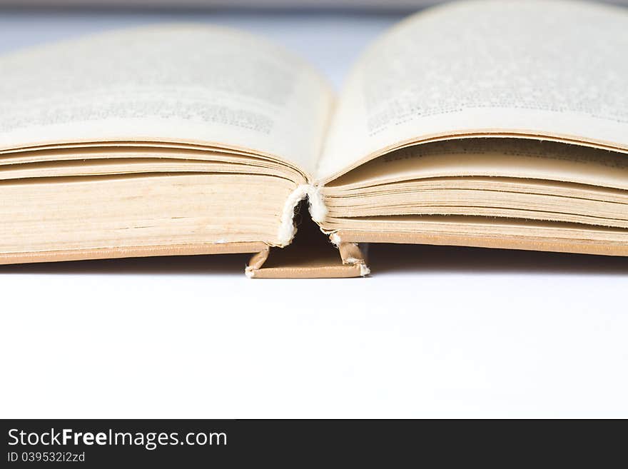 Hardcover book on white table. Hardcover book on white table