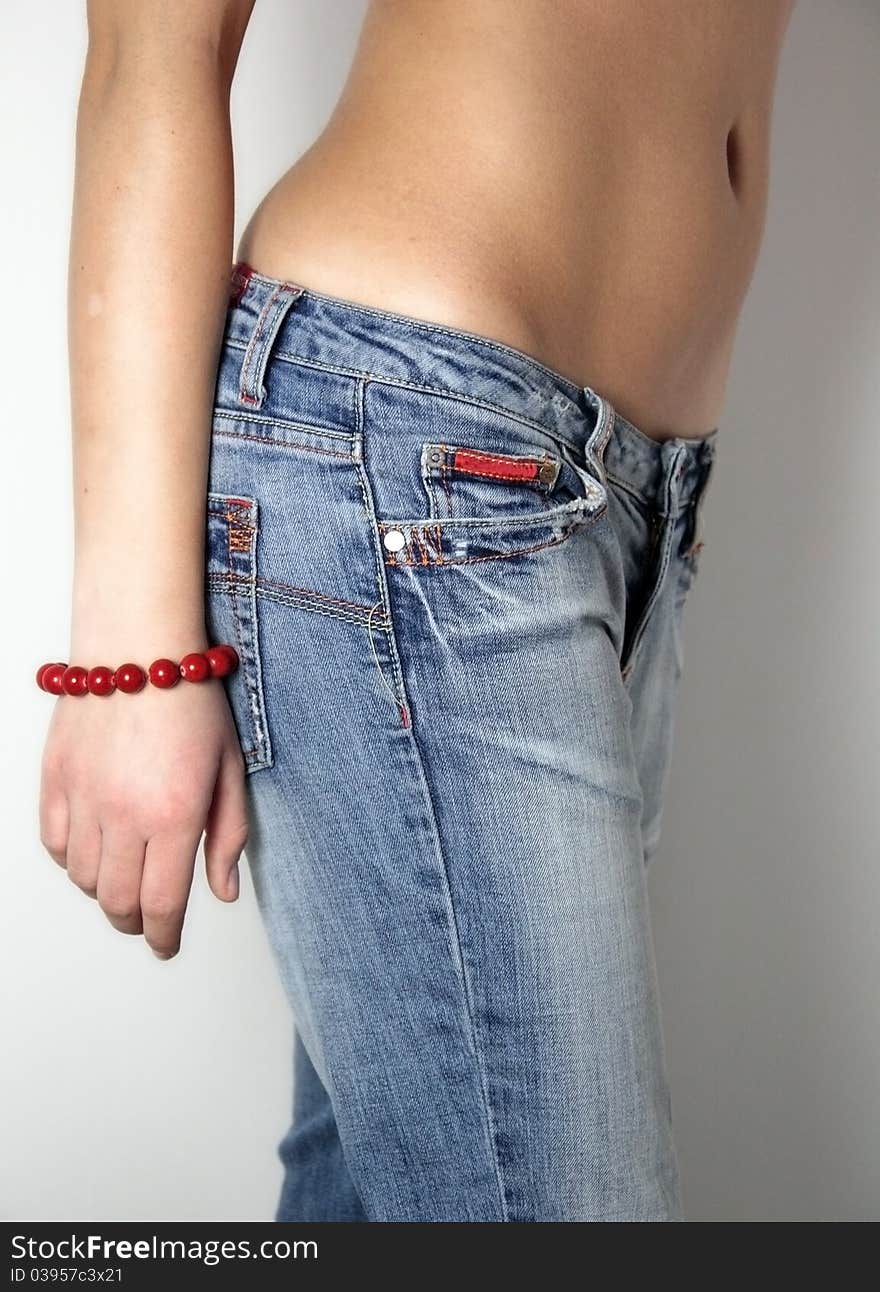 Woman in old blue jeans and stomach. Woman in old blue jeans and stomach