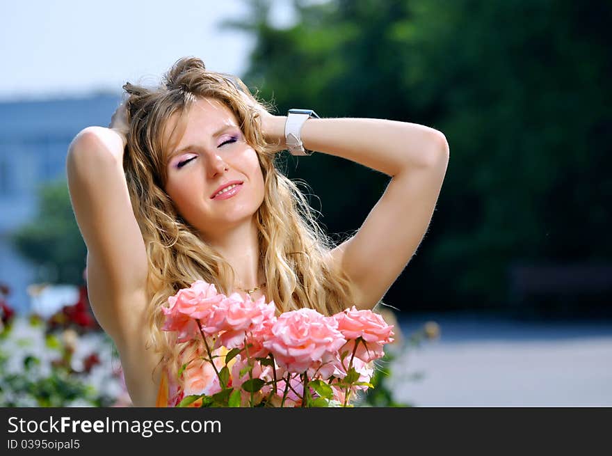 Portrait of the young girl with roses