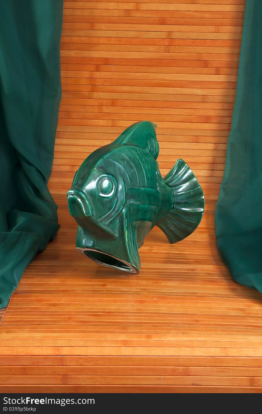 Curious object! It represent a big green fish ,rare piece of pottery. Curious object! It represent a big green fish ,rare piece of pottery.