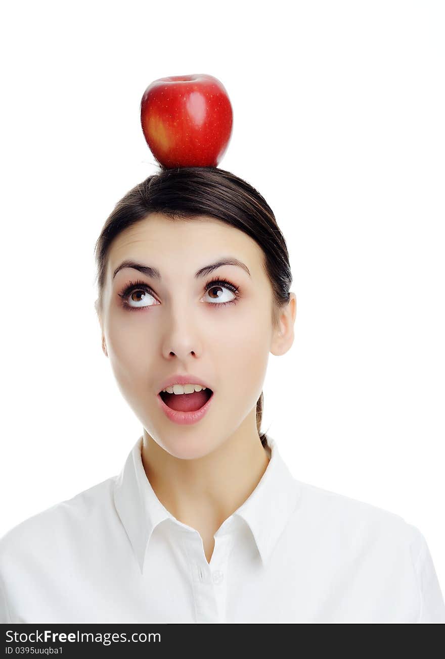 An image of girl with apple on her head. An image of girl with apple on her head.