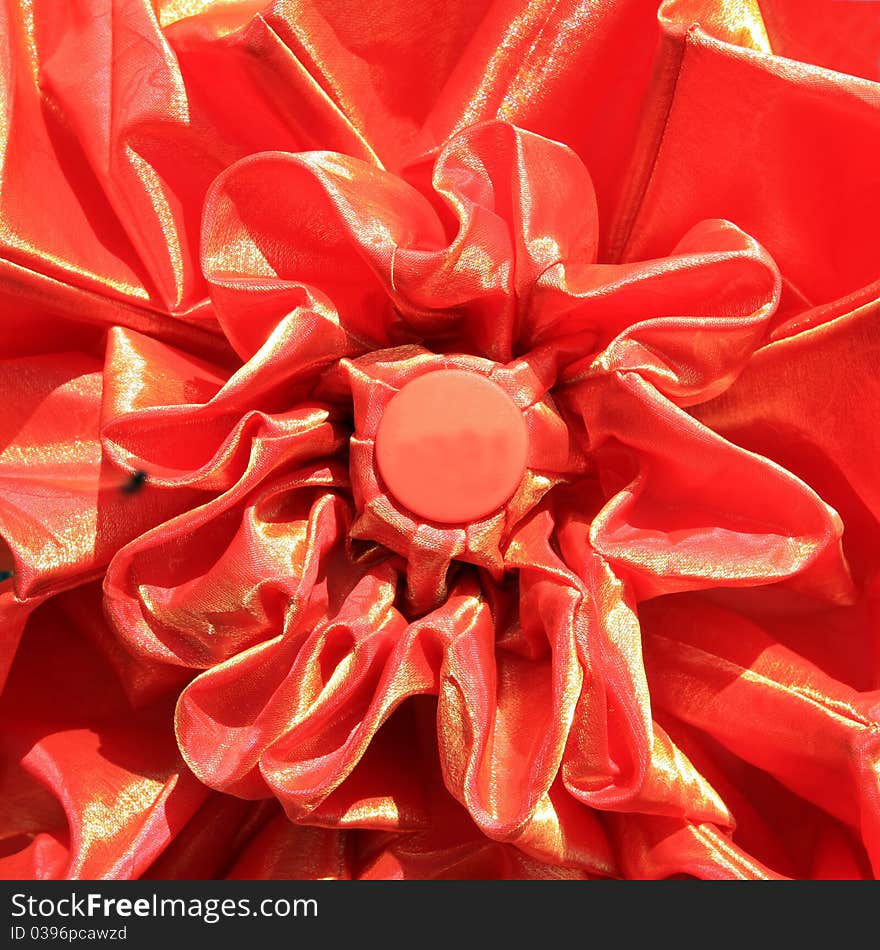 Red umbrella on a red background