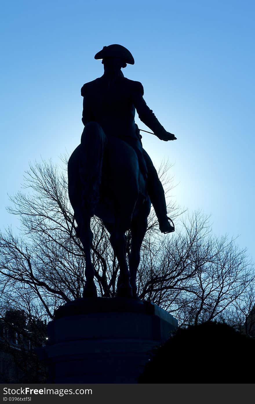 View of the George Washington Monument Backlit in the Boston Public Garden in Boston, Massachusetts - USA. View of the George Washington Monument Backlit in the Boston Public Garden in Boston, Massachusetts - USA.