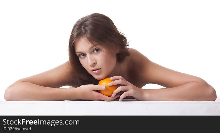 The woman with an orange fruit the isolated image