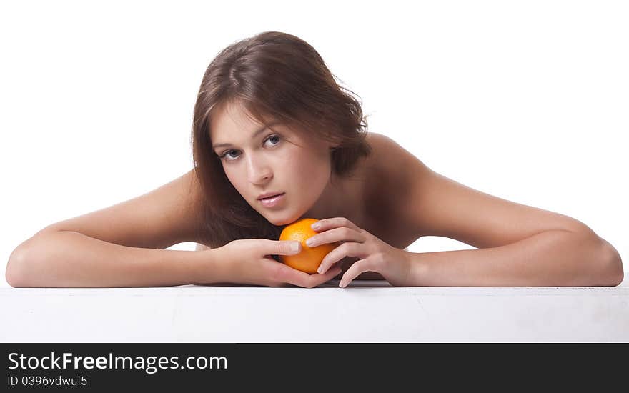 The woman with an orange fruit the isolated image