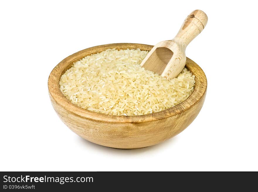 Rice in wood plate isolated